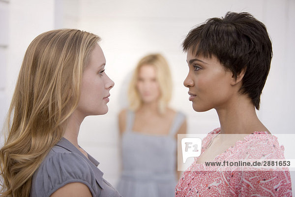 Two women standing face to face