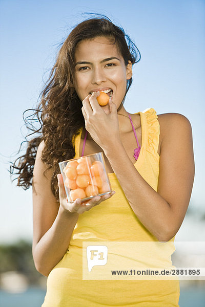 Woman eating fruits