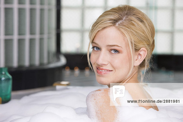 Woman taking a bubble bath