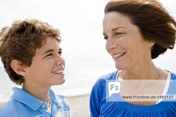 Woman and her grandson looking at each other and smiling