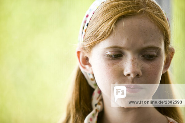 Close-up of a girl thinking