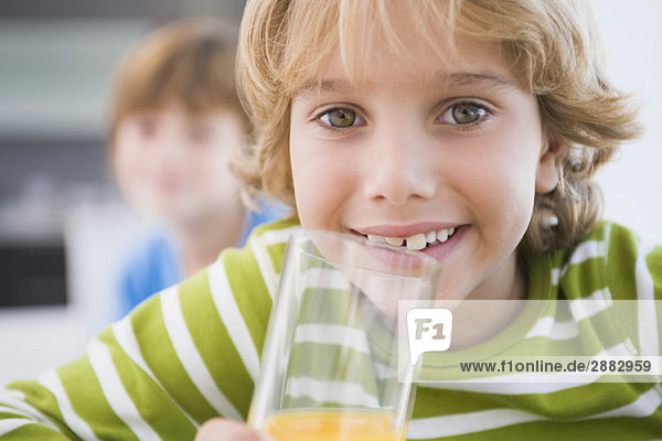 Boy drinking a glass of juice