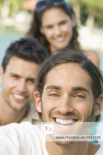 Three friends smiling