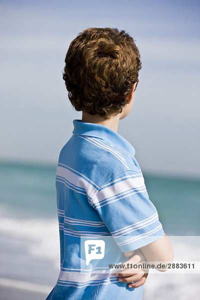Boy standing on the beach