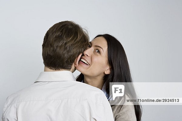 Portrait of a man and woman being affectionate