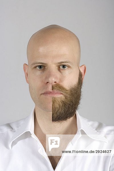 Ein Mann mit einem halb rasierten Bart und Schnurrbart.
