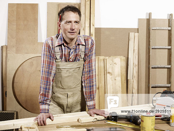 A man standing in a wood workshop