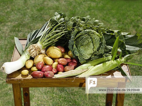 Selection of fresh vegetables on a wooden table