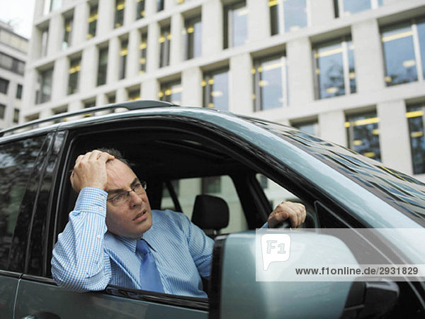 Frustrated businessman in car