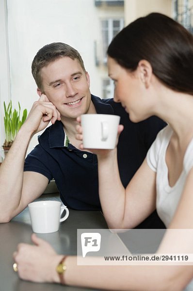 Couple drinking coffee at home