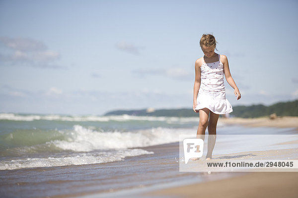 Girl walking on the beach  Warren Dunes State Park  Michigan