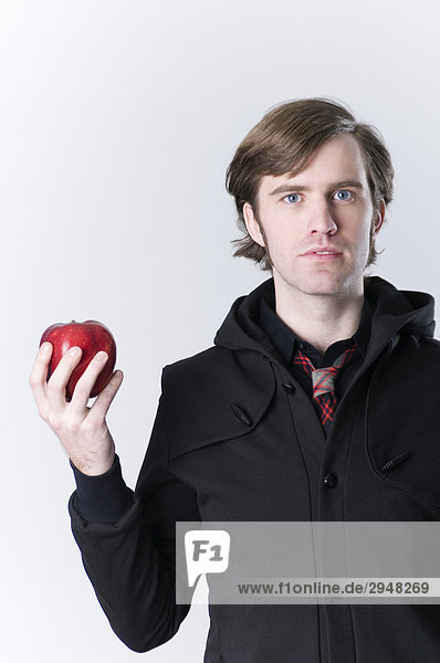 Man Holding a Red Apple