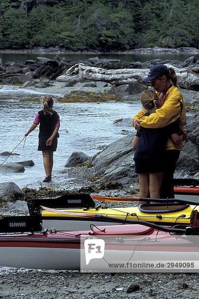 Family kayaking in the Broken Group Islands  British Columbia