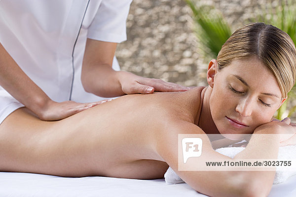 Young woman receiving massage