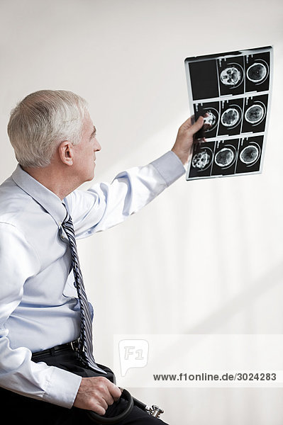 Doctor looking at mri scan