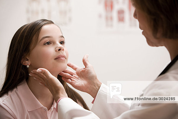 Doctor examining girl