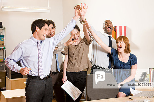 Office workers celebrating