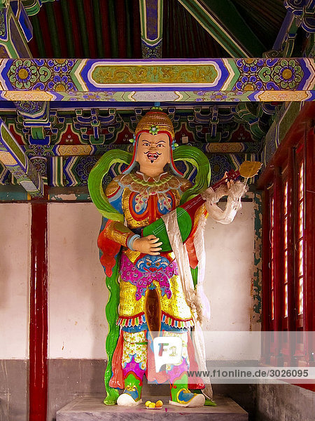 Headline: Statue inside of the Miaoying Temple Beijing China
