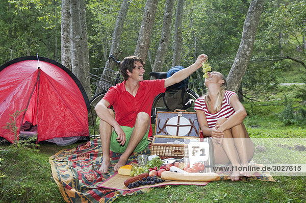 Austria  Salzburger Land  Couple having a picnic
