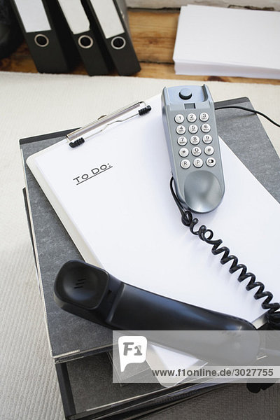 Workplace  Telephone  clipboard and folders