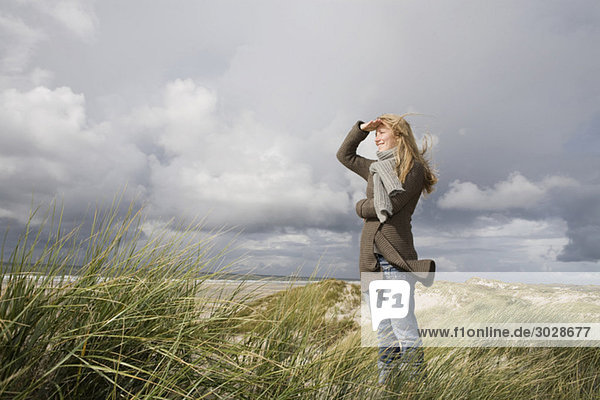 Germany  Schleswig Holstein  Amrum  Woman Looking out to Sea