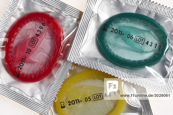 Multi-coloured Condoms wrapped in plastic