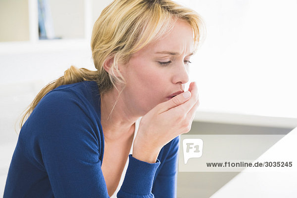 Close-up of a woman coughing