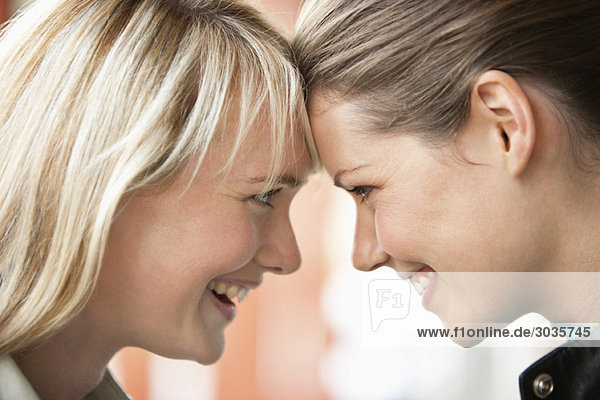 Close-up of two women smiling