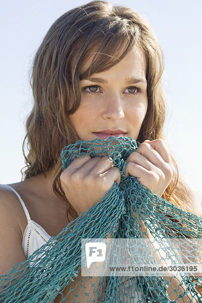 Close-up of a woman holding a net