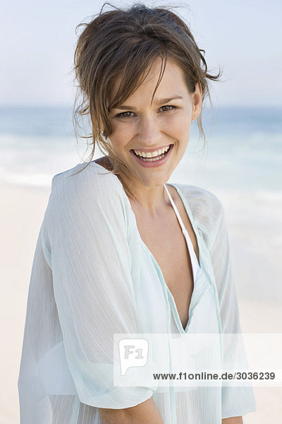 Portrait of a woman smiling on the beach