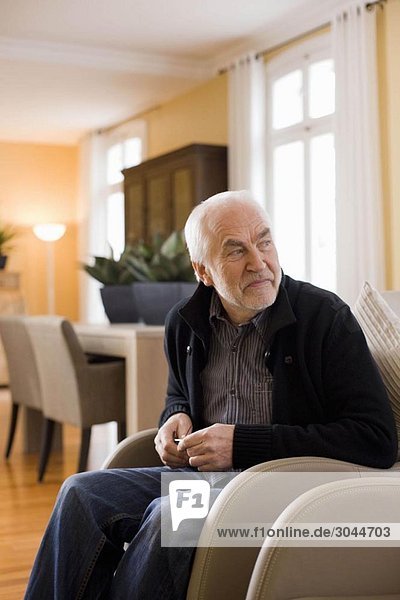 old man sitting in chair