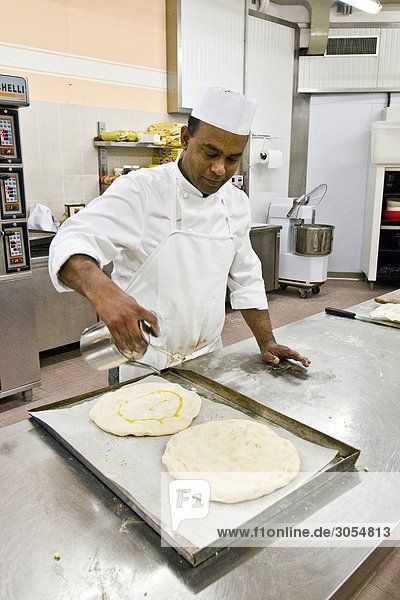 Chef preparing pizza