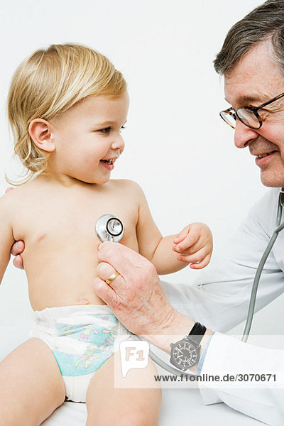Little boy and doctor with stethoscope