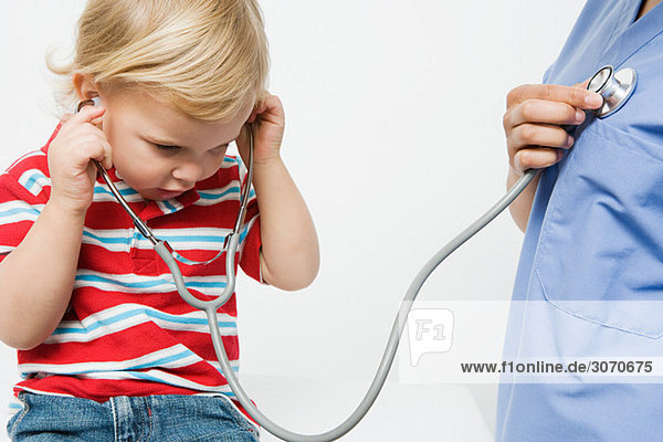 Little boy and nurse with stethoscope