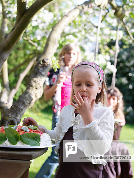 People at a garden party Skane Sweden.