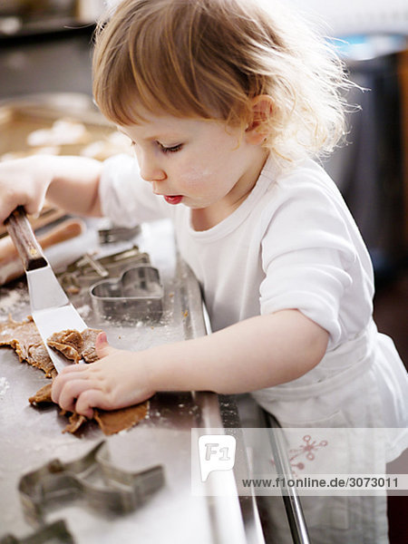 A little girl baking gingerbread Sweden