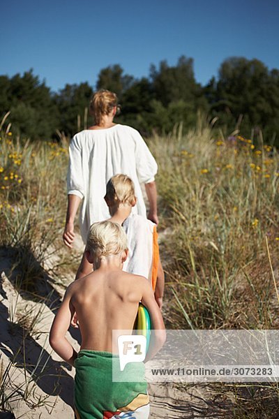 A family leaving the beach Gotland Sweden.
