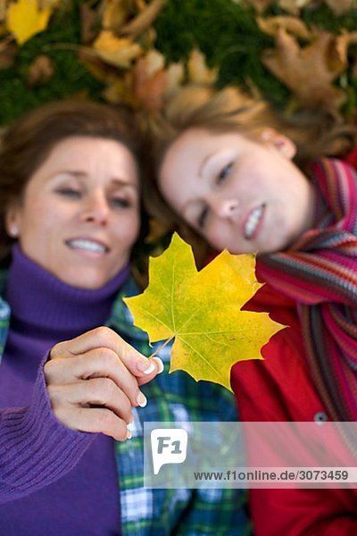 Mother daughter and autumn leaves Sweden.