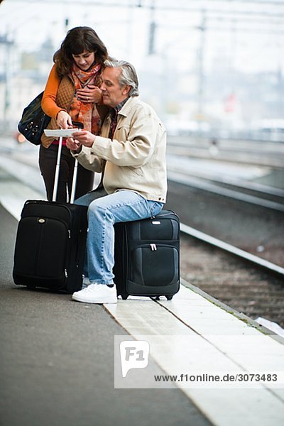 A couple waiting for a train Sweden.