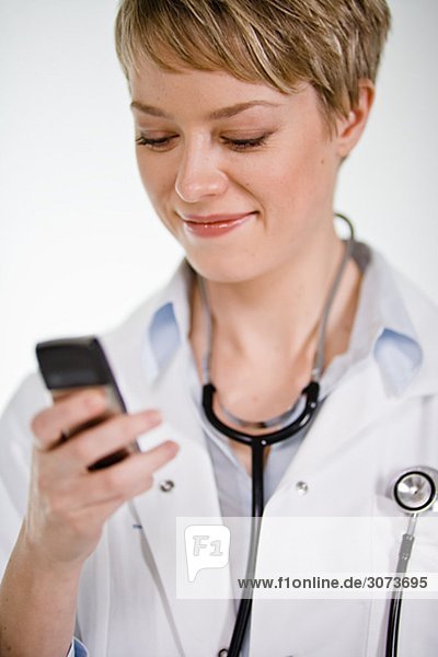 A female doctor using a mobile phone Sweden.