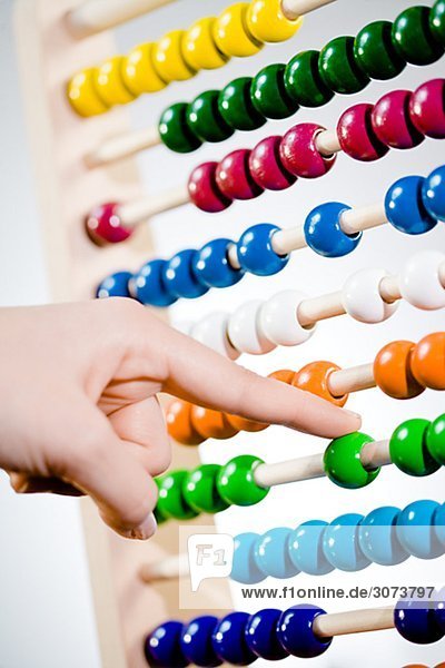 A woman using an abacus.