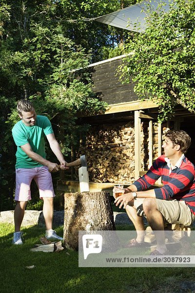 Friends slicing wood