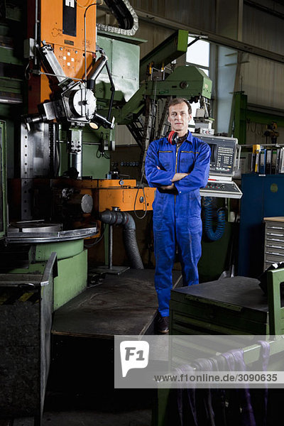 Portrait of a worker in a metal parts factory