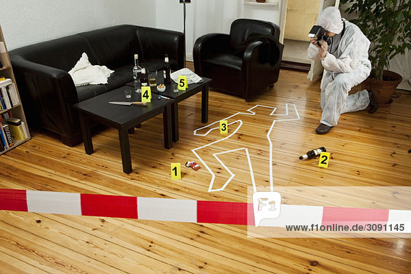 A person photographing a crime scene