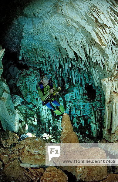 Scuba diver in underwater cave Cueva Taina  Punta Cana  Dominican Republic