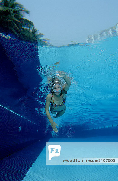 Woman swimming in open-air pool  Germany  Bavaria  underwater shot