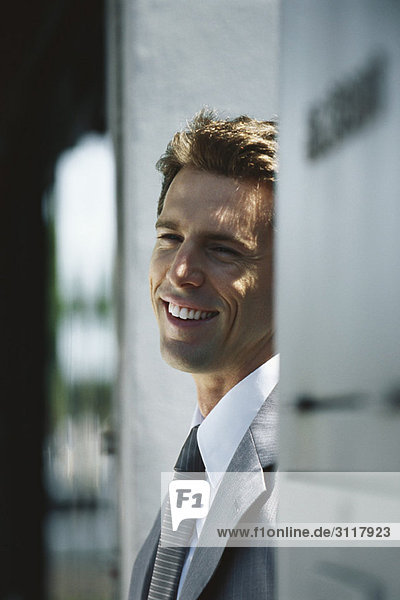 Businessman smiling and looking away  portrait