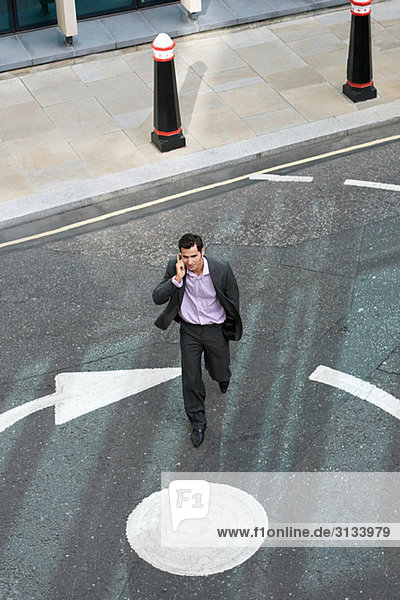 Businessman crossing the street