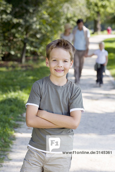 A portrait of a boy in the park