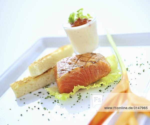 Lightly fried  marinated salmon with white bread